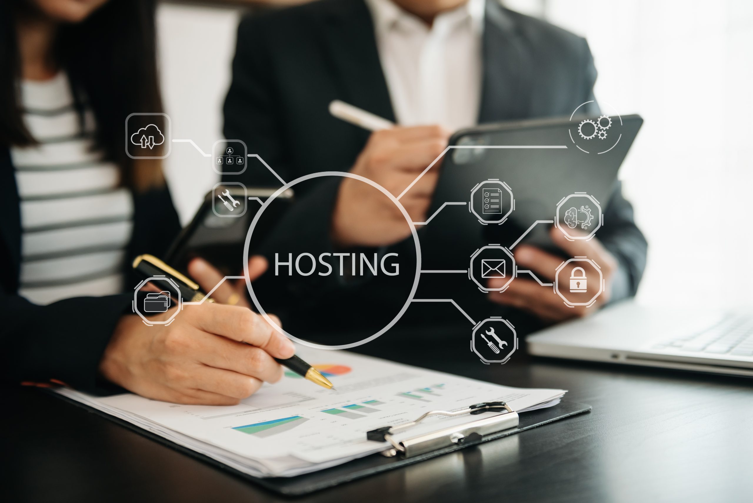 Web hosting concept, business using computer and presses his finger on the virtual screen inscription Hosting on desk, Internet, business, Technology and network concept.